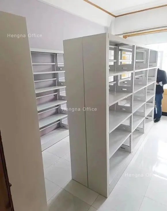 Steel bookshelves in school classroom back wall installation