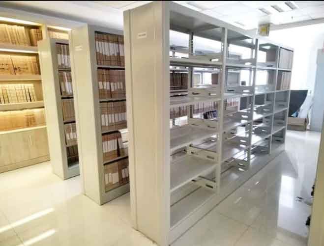 Steel library shelving undergoing weight