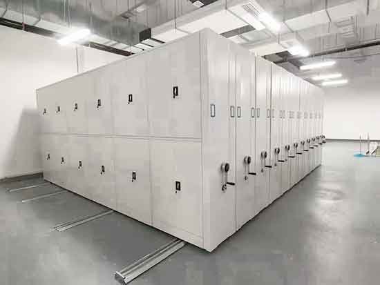 High density mobile shelving system with closed compact formation in archive facility