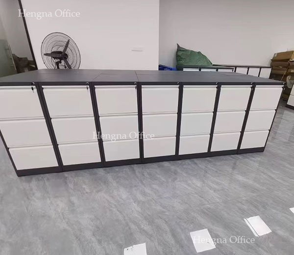 close-up of central lock system on 3-drawer steel filing cabinet for legal documents