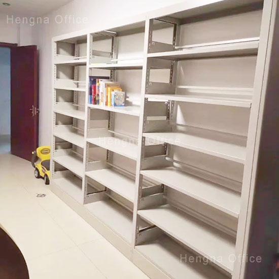 Low-height anti-tipping steel bookcase in a classroom with 3 kid-safe tiers for children